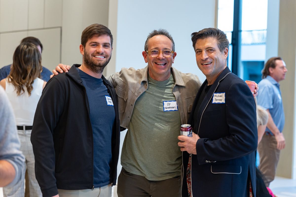 Founders and an investor connecting after an Investor Dinner in a private home.